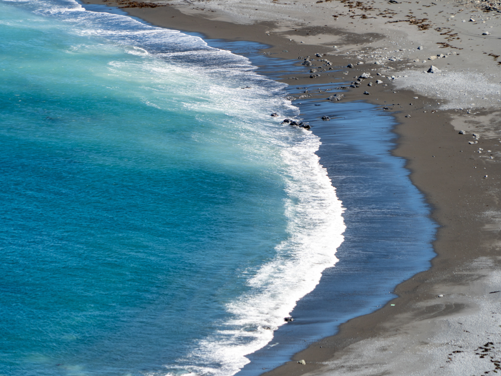 Blick vom Cape Palliser Lighthouse auf die Bucht